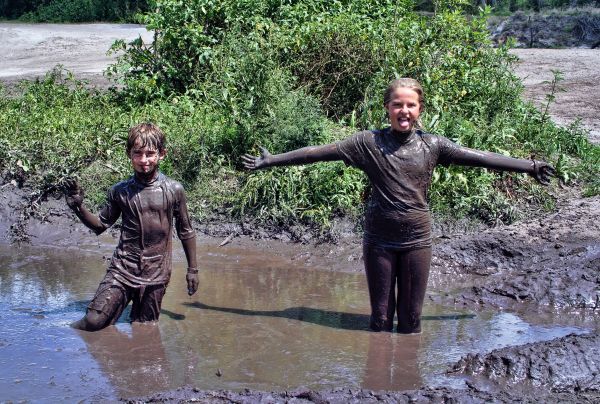 kids playing in the mud